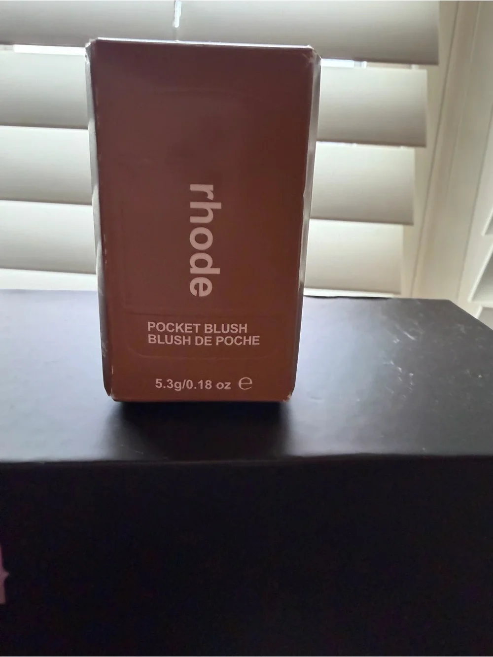 RHODE Satin Buildable Color in Brown Packaging with Pink Accent